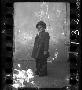 Portrait of a boy in a coat and a hat