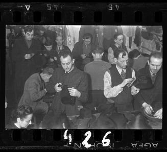 Men making hats in a workshop ("ressort") in the ghetto