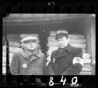 A  Jewish policeman and an unidentified man with glasses