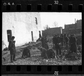 Men working on the street, probably building or fixing a road