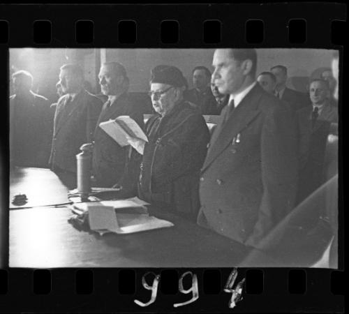 A judge reading aloud the charges at the trial of Hans Biebow, former head of the Lodz Ghetto's German administration