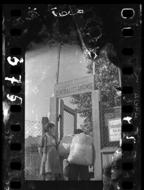 Residents walking through prison gate on Czarnecki Street prior to deportation