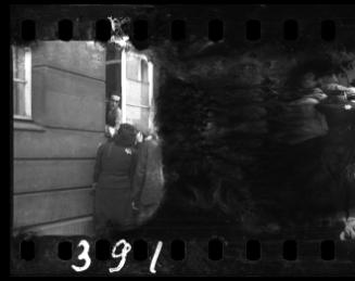 Group of residents gathered outside a window