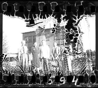 Ghetto residents in front of a three-storey building