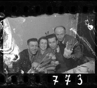 Residents posing for the camera with flowers