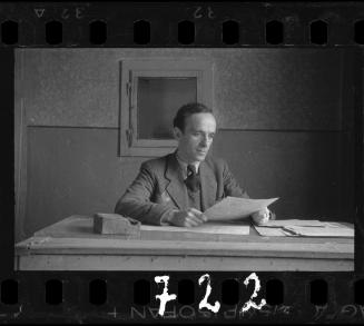 Manager of the soup kitchen sitting at a table