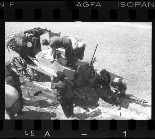 Residents unloading their belongings from a cart