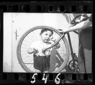Portrait of a young boy with a bike