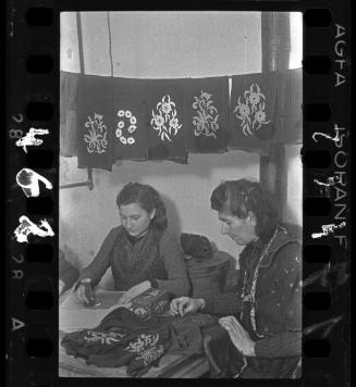 "Women embroidering goods for German shops" in the Textile Department