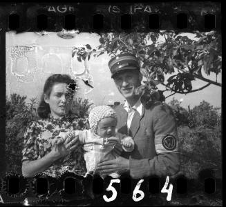 A Jewish policeman with his wife and child in Marysin