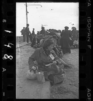 Residents deported to Chelmno death camp; woman in foreground with #794