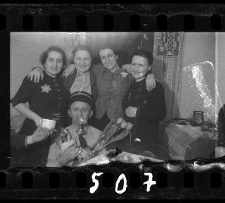 A ghetto policeman celebrating with friends