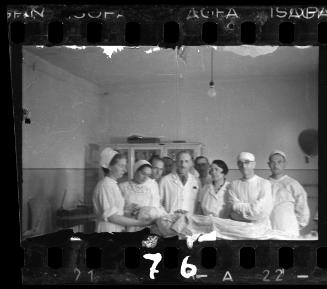 Doctors and nurses with patient