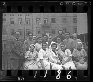 Group portrait of Dr. Kagan with doctors, nurses and hospital staff