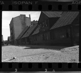 Deserted street with unidentified buildings in the ghetto