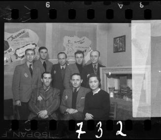 Eight residents with Alta Zaifman poster in the backgroung