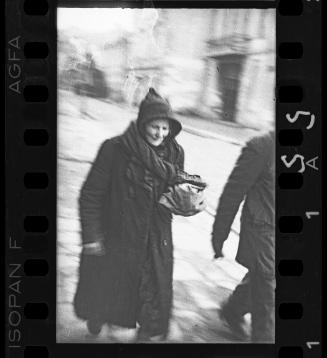 Elderly person walking down the street