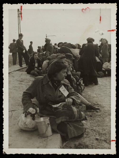 Residents deported to Chelmno death camp; woman in foreground with #794