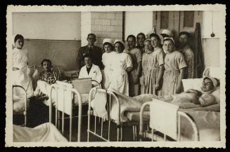 Group portrait of nurses and patients with Dr. Kagan
