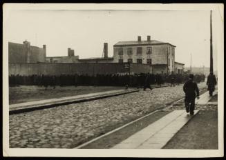 Line-up of ghetto residents around street corner for deportation