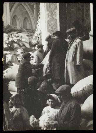 Residents sorting piles of sacks