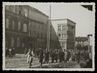 Residents gathered outside the hospital at 36 Lagiewnicka Street in the ghetto