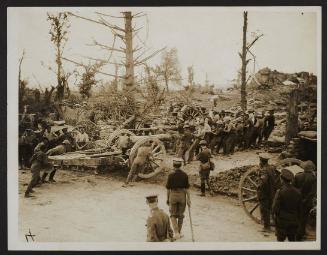 Men handling a big howitzer