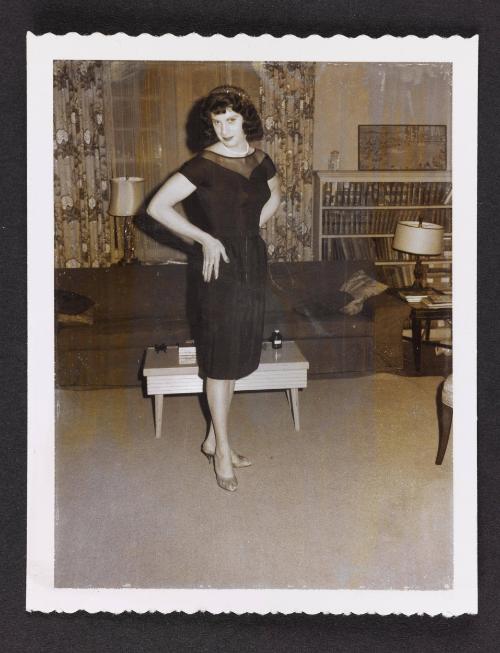 [Lee in a black dress, location unknown]
