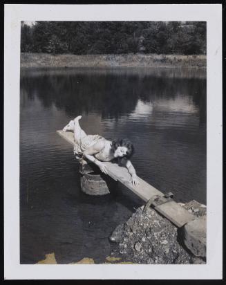 [Susanna lying on the diving board, Casa Susanna, Hunter, NY]

