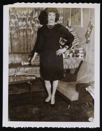 [Lee in a black dress, New York City apartment]
