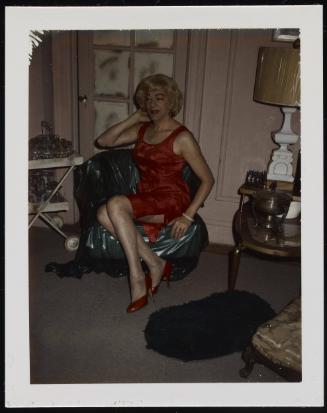 [Susanna in a red dress and red shoes, New York City apartment]
