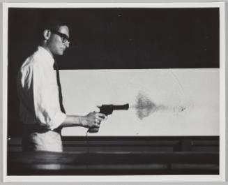 man firing gun